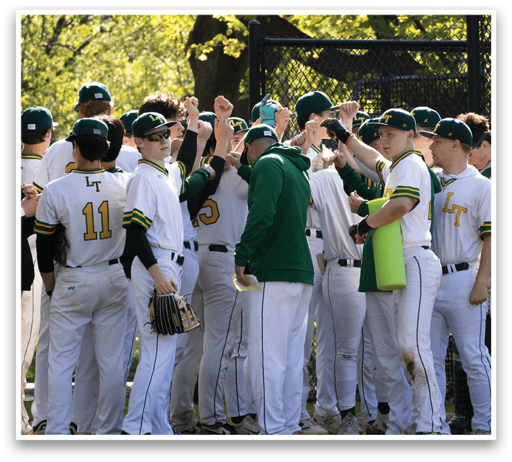 A group of baseball players wearing green and white uniforms. Description generated by AI