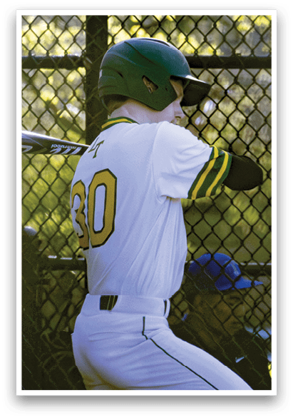 A baseball player in a green helmet and white uniform is swinging a bat. Description generated by AI