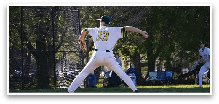 A baseball player in a white uniform is pitching a ball. Description generated by AI