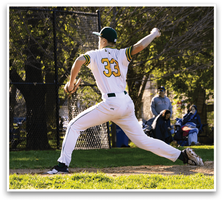 A baseball player wearing a green and white uniform is throwing a ball. Description generated by AI