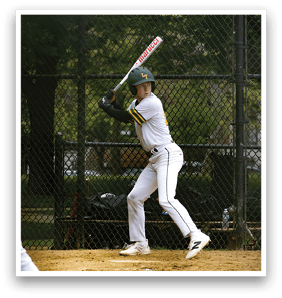 A baseball player in a white uniform is swinging a bat. Description generated by AI