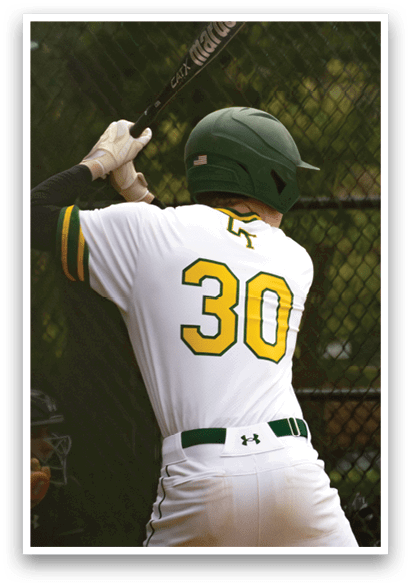 A baseball player in a white and green uniform is swinging a bat. Description generated by AI