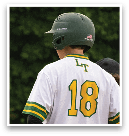 A baseball player wearing a green and yellow jersey with the number 18 on the back. Description generated by AI