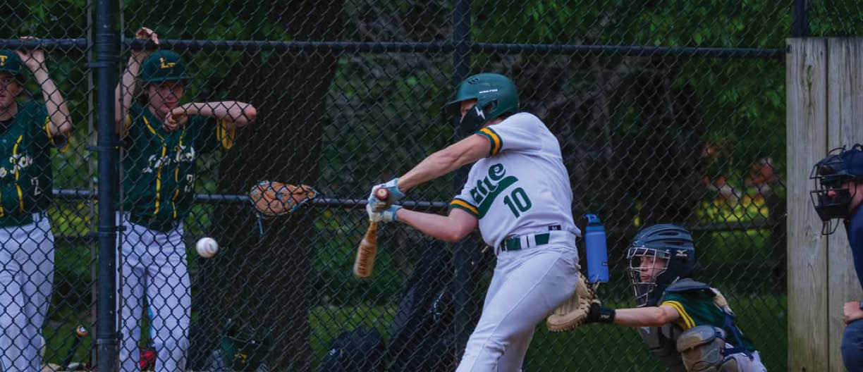 A baseball player is swinging a bat at a ball. Description generated by AI