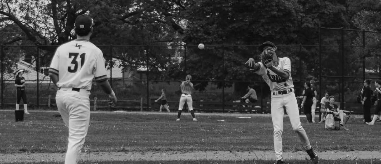 A baseball player in a white uniform is throwing a ball. Description generated by AI