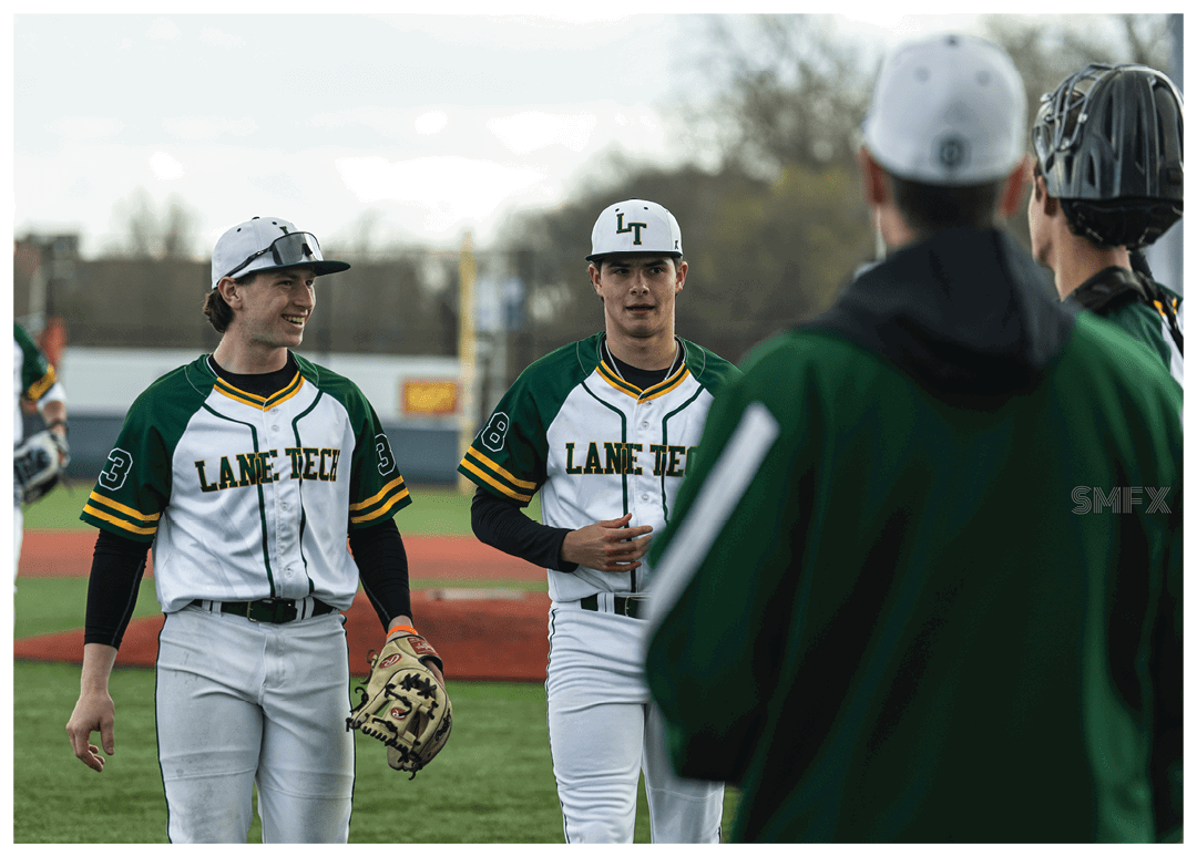 Two baseball players walking on the field. Description generated by AI