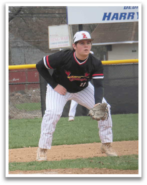 A baseball player in a black and red jersey is crouching on the field, ready to catch a ball. AI generated content