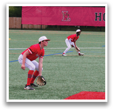 A baseball game is taking place on a field with a group of men playing. One man is in the process of catching a ball while another player is running to a base. The players are wearing baseball gloves and are positioned around the field. AI generated content