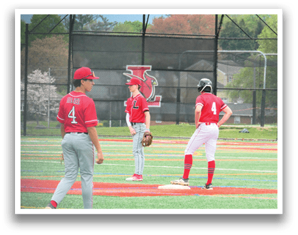Three baseball players are standing on a field, wearing red and white uniforms. One player is holding a baseball glove, and another player is holding a baseball bat. They are all standing on the field, ready to play. AI generated content