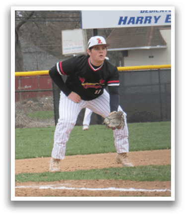 A baseball player in a black and red jersey is standing on a baseball field, ready to catch a ball. AI generated content