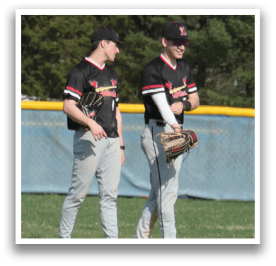 Two baseball players standing on a field, one holding a mitt and the other holding a glove. AI generated content