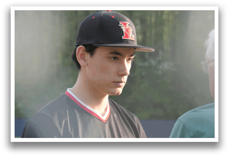 A man wearing a baseball cap and a black and red shirt is standing next to an older man. AI generated content