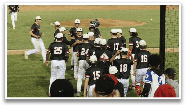 Baseball players in black and white uniforms are hugging each other on the field. AI generated content
