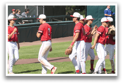 Baseball players wearing red shirts and white pants are walking on the field. AI generated content