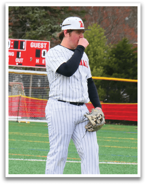 A baseball player wearing a white uniform stands on a field. AI generated content