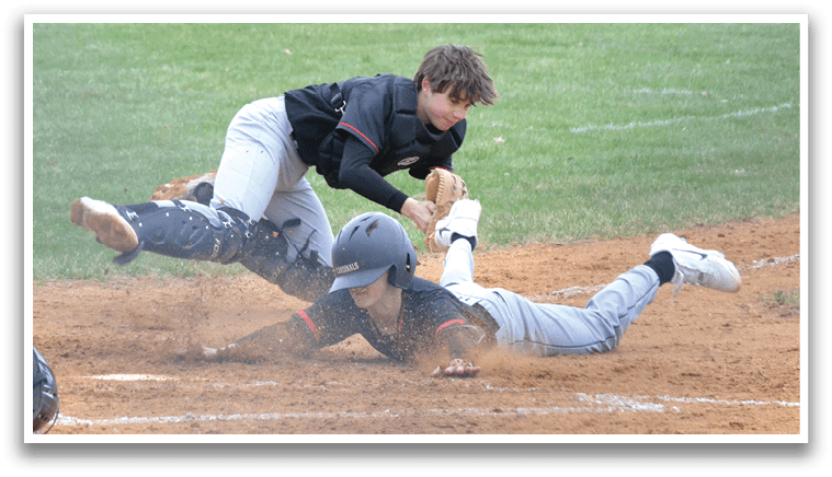 A baseball player slides into home plate. Description generated by AI