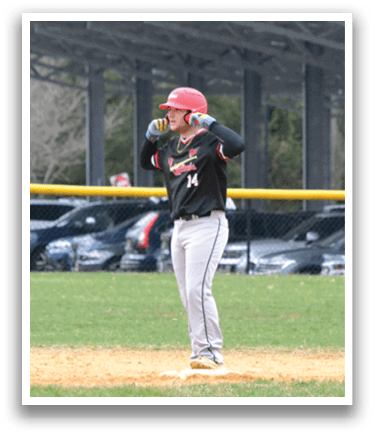 A baseball player is standing on the field with his arms up. Description generated by AI
