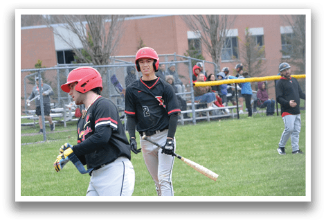 A baseball player running to first base. Description generated by AI