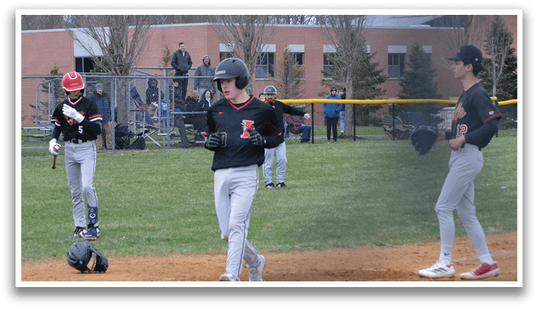 A baseball game is taking place on a field. Description generated by AI