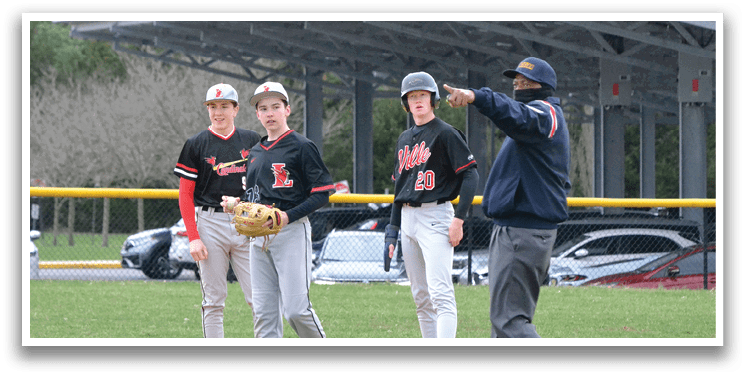 A baseball game is taking place in a field. Description generated by AI