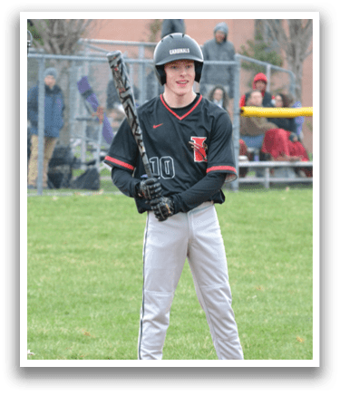 A baseball player holding a bat. Description generated by AI