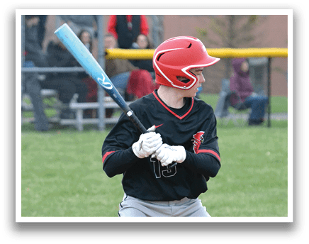 A baseball player is swinging a bat at a ball. Description generated by AI