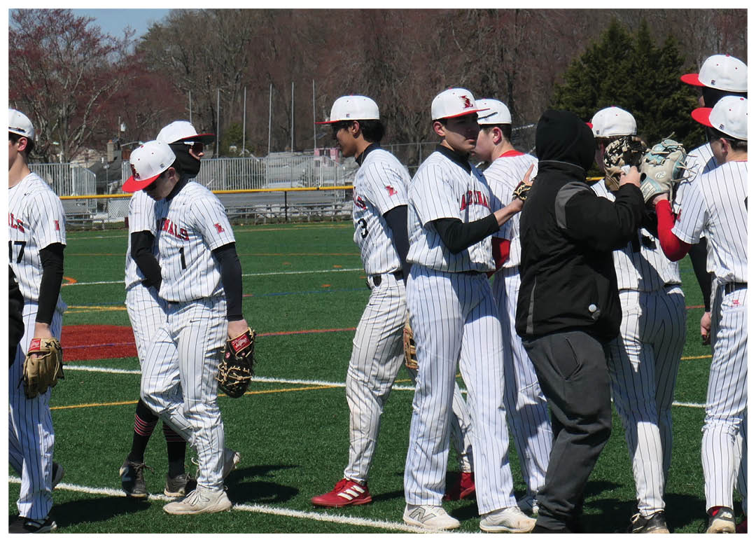 A group of baseball players on a field. Description generated by AI