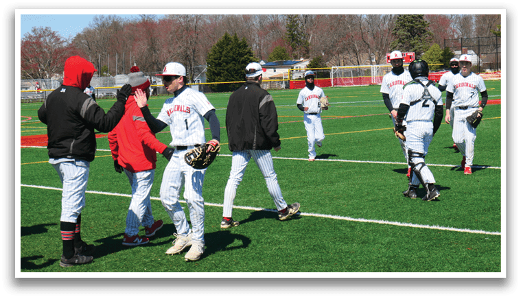 A group of baseball players on a field. Description generated by AI