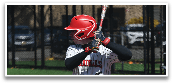 A baseball player in a red helmet and black and white uniform is holding a bat and getting ready to swing. Description generated by AI