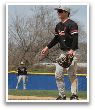 A baseball player wearing a black shirt and white pants. Description generated by AI