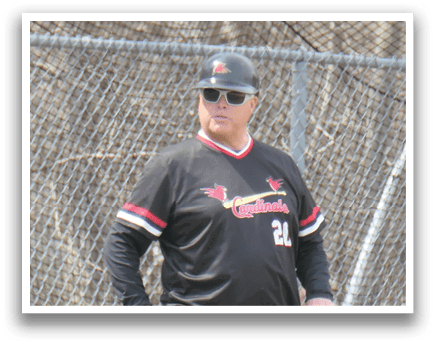 A man wearing a black and red shirt. Description generated by AI