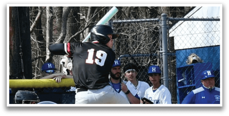 A baseball player is swinging a bat. Description generated by AI