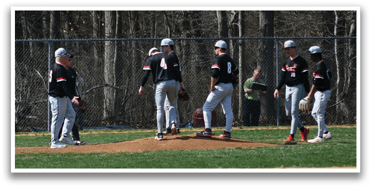 A group of baseball players on a field. Description generated by AI