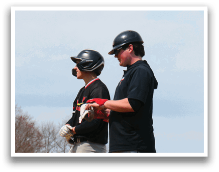 A group of men standing on a baseball field. Description generated by AI