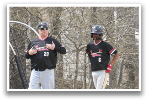 Two men wearing baseball uniforms. Description generated by AI