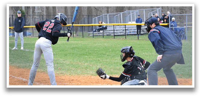 A baseball player is swinging a bat at a ball. Description generated by AI