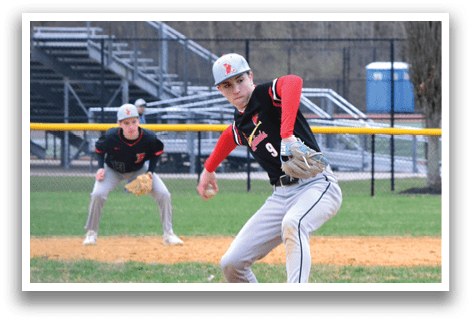 A baseball player is pitching a ball. Description generated by AI