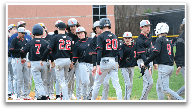 A group of baseball players wearing black and red uniforms. Description generated by AI