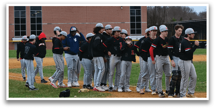 Baseball players on a field. Description generated by AI