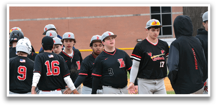 Baseball players wearing black and red uniforms. Description generated by AI