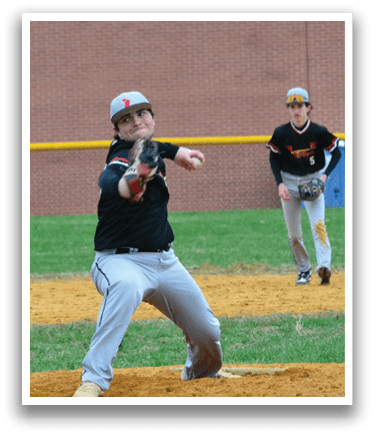 A baseball player in a black shirt and white pants is pitching a ball. Description generated by AI