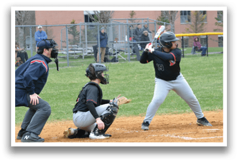 A baseball player is swinging a bat at a ball. Description generated by AI
