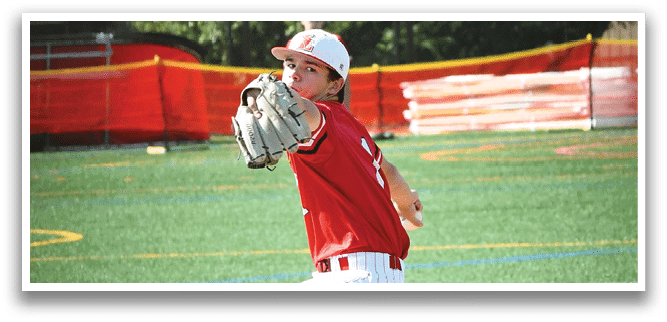 A baseball player in a red shirt and white pants is pitching a ball. Description generated by AI
