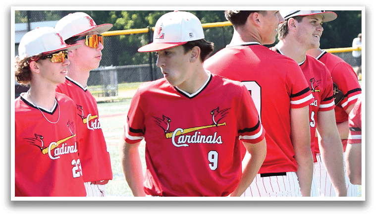 A group of baseball players wearing red and white uniforms. Description generated by AI