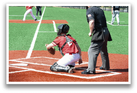 A baseball player is kneeling on the field. Description generated by AI