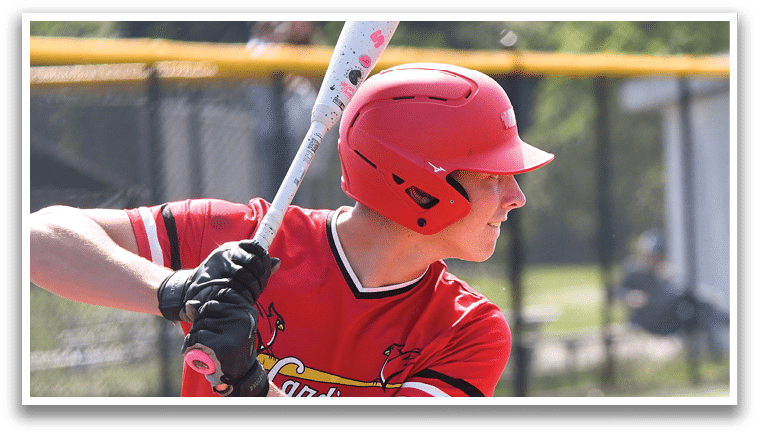 A baseball player in a red shirt and red helmet is swinging a bat. Description generated by AI