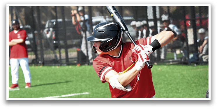 A baseball player in a red and white uniform is swinging a bat. Description generated by AI