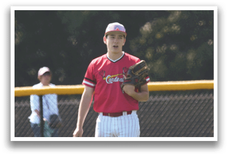 A man wearing a red shirt and white pants holding a baseball glove. Description generated by AI