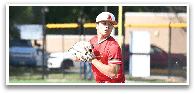 A baseball player in a red shirt and white pants is holding a baseball glove. Description generated by AI