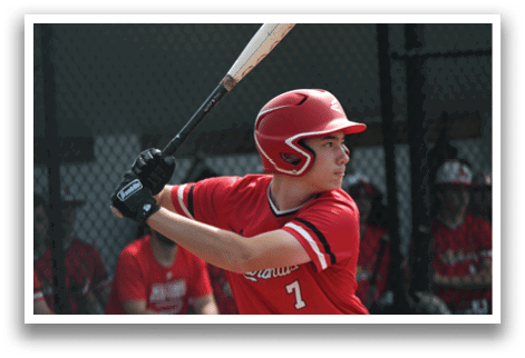 A baseball player holding a bat. Description generated by AI